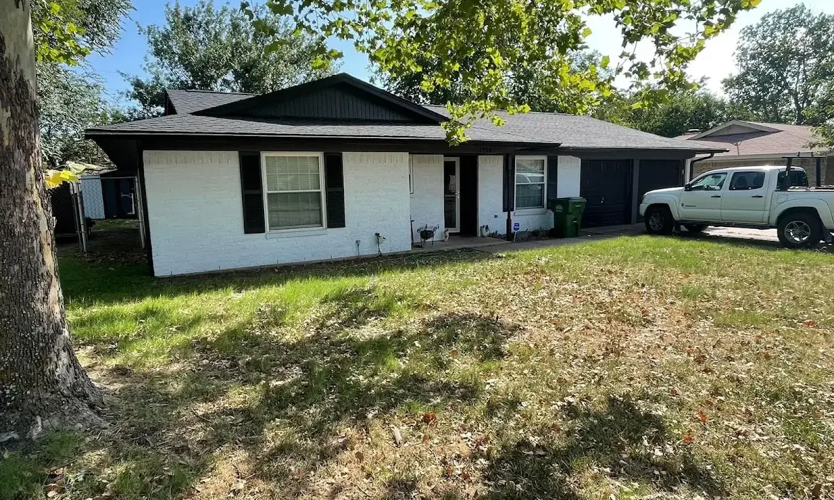Professional roofing crew working on a residential roof in Zion